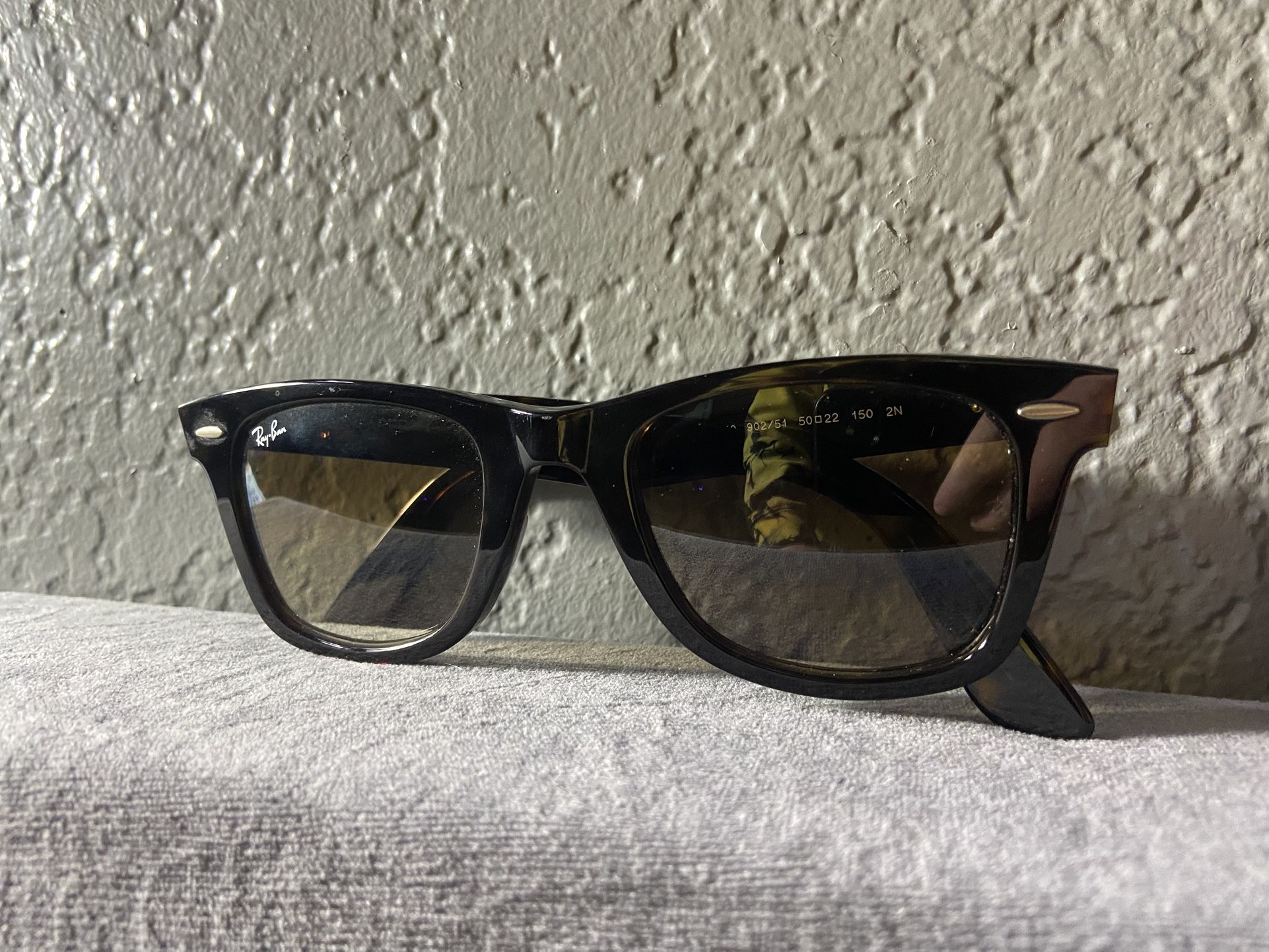 Ray-Ban Wayfarer sunglasses.