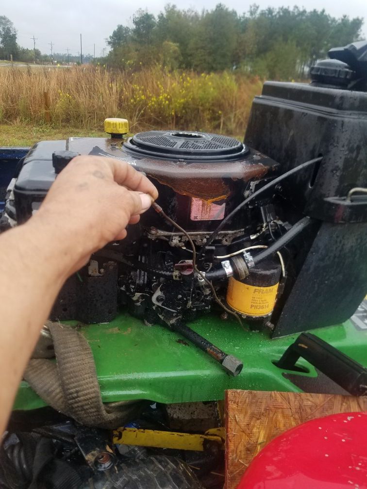 John Deere mowing tractor