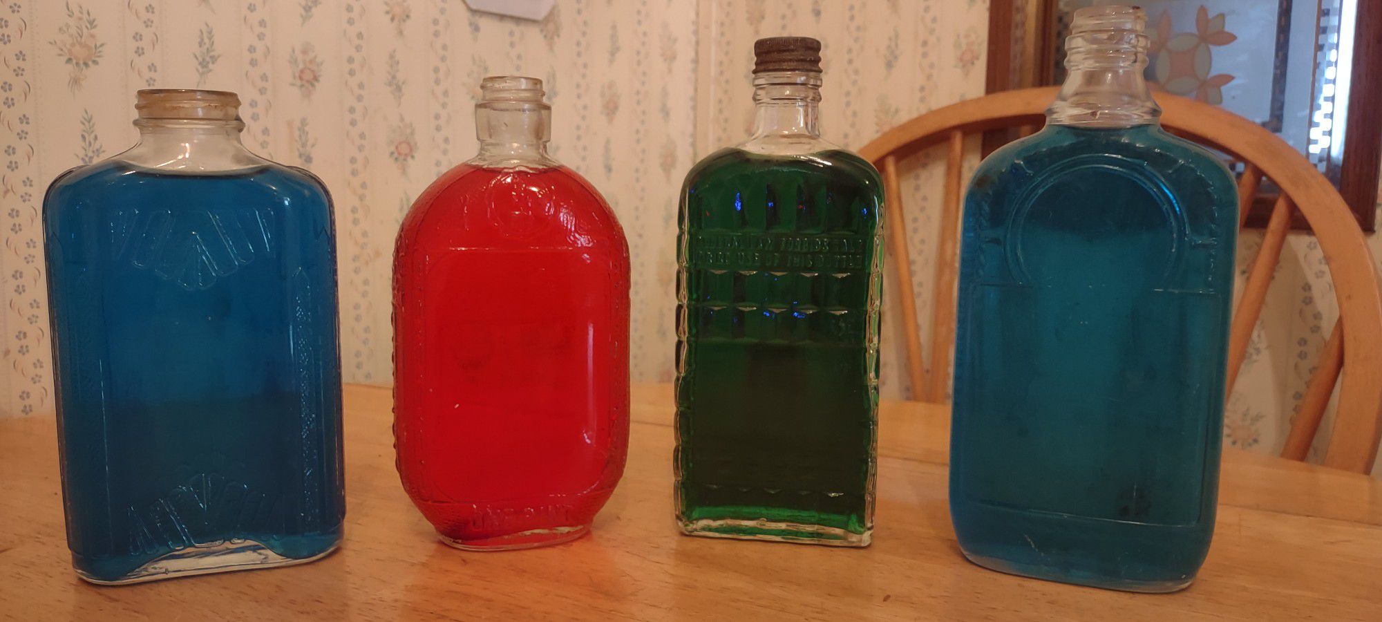7 ANTIQUE ORNATE BOTTLES!!! COLOR ADDED TO WATER TO SHOW DESIGNS!!! 9