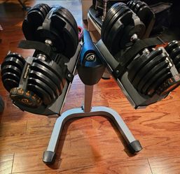 Nautilus adjustable 5 to 52.5 pound dumbells with stand..