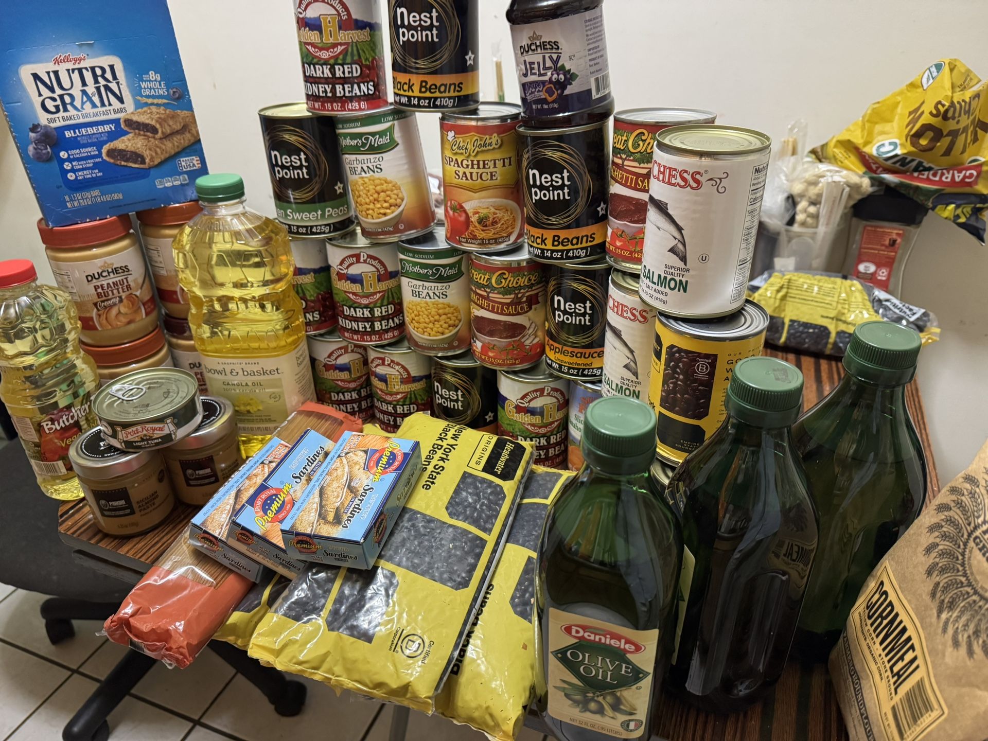 Cans & oil & peanut butter & noodles & beans