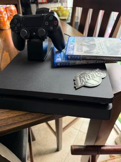 Sony PlayStation 4 Slim with Controller, Charging Dock, and 2 Games
