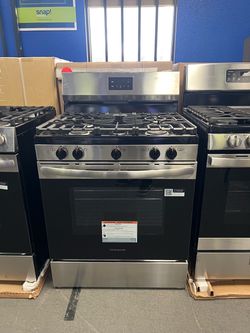 Frigidaire stainless steel and black gas range