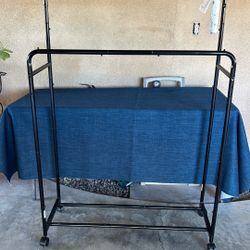 Black clothes rack has two levels