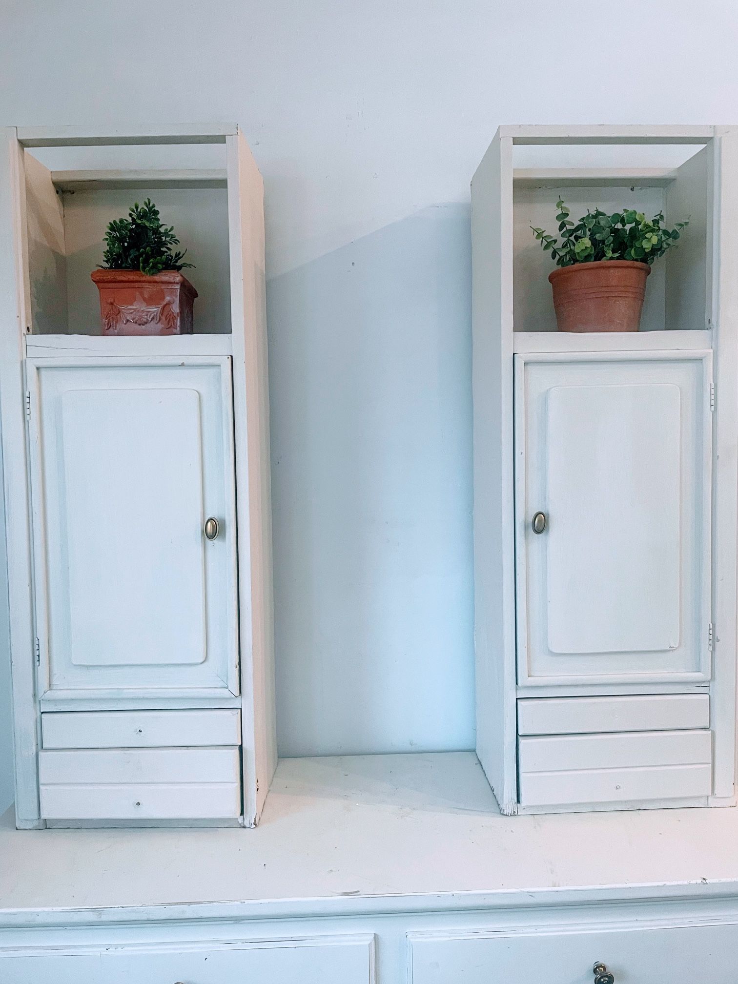 Two Off White Matching Tall painted wood wall cabinet open shelf & drawers