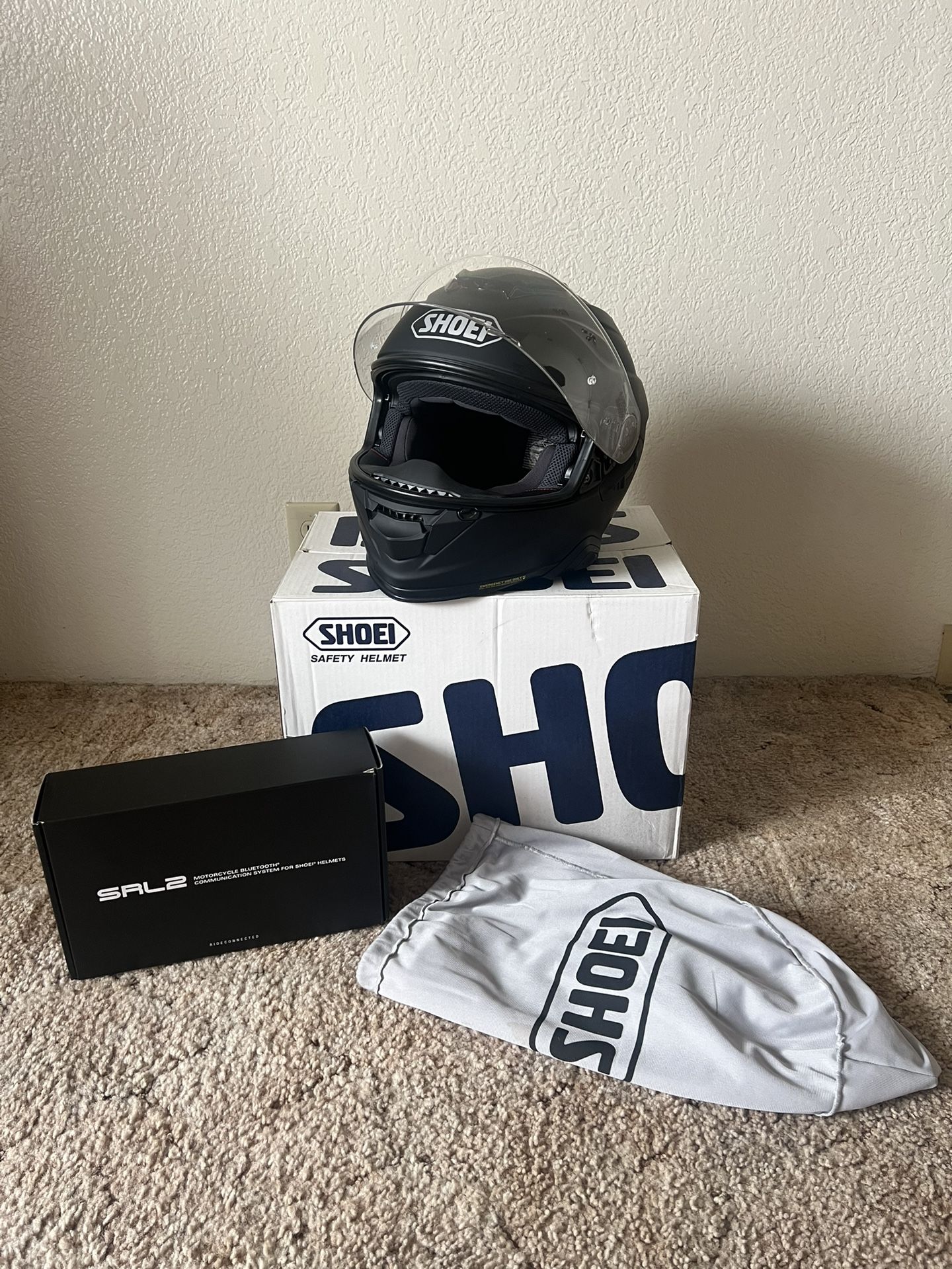 SHOEI motorcycle helmet + SENA Bluetooth device