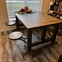 Wood Iron Table With Attached Swivel Stools