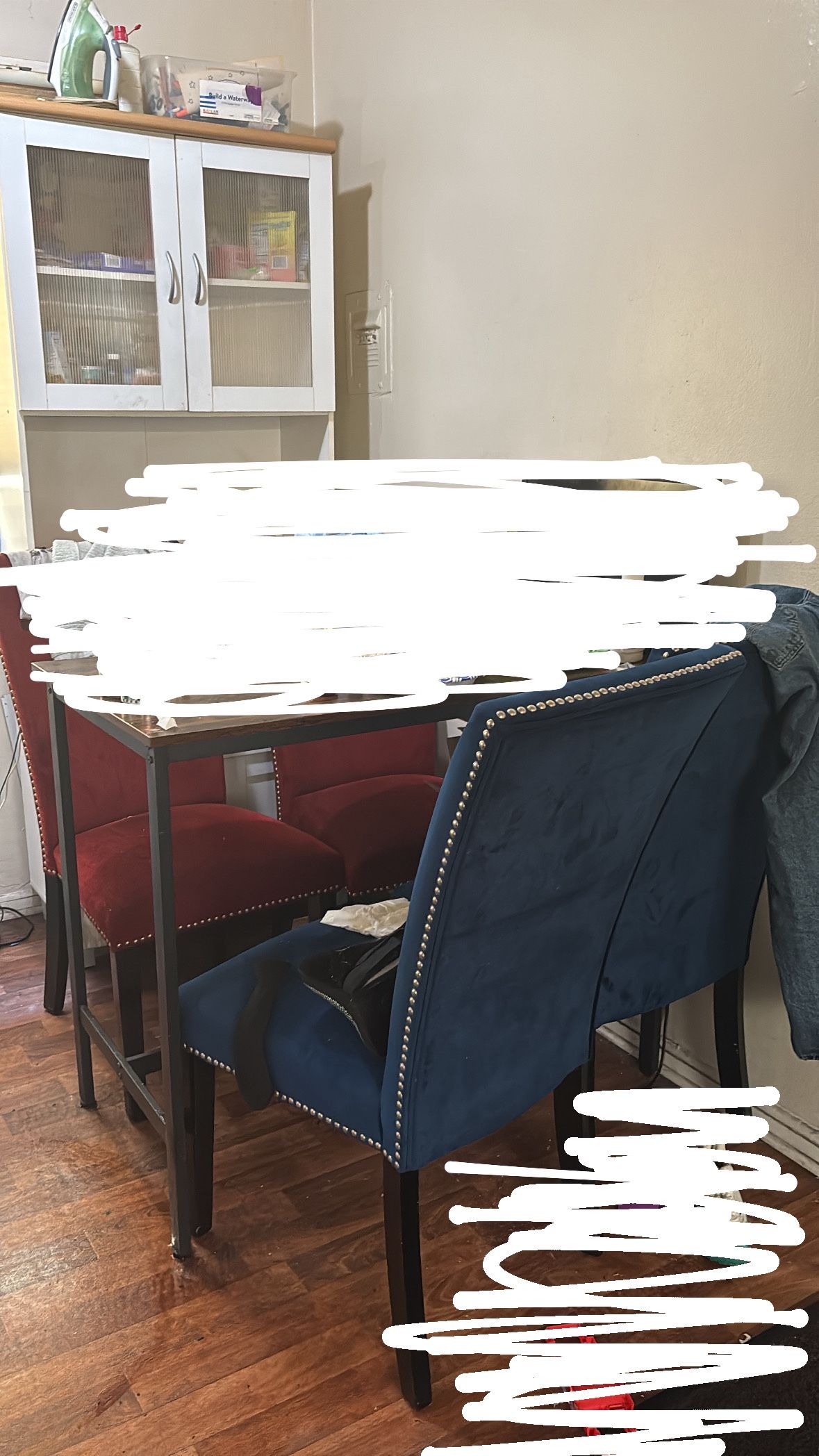 Wooden Table And Red And Blue Suade Chairs