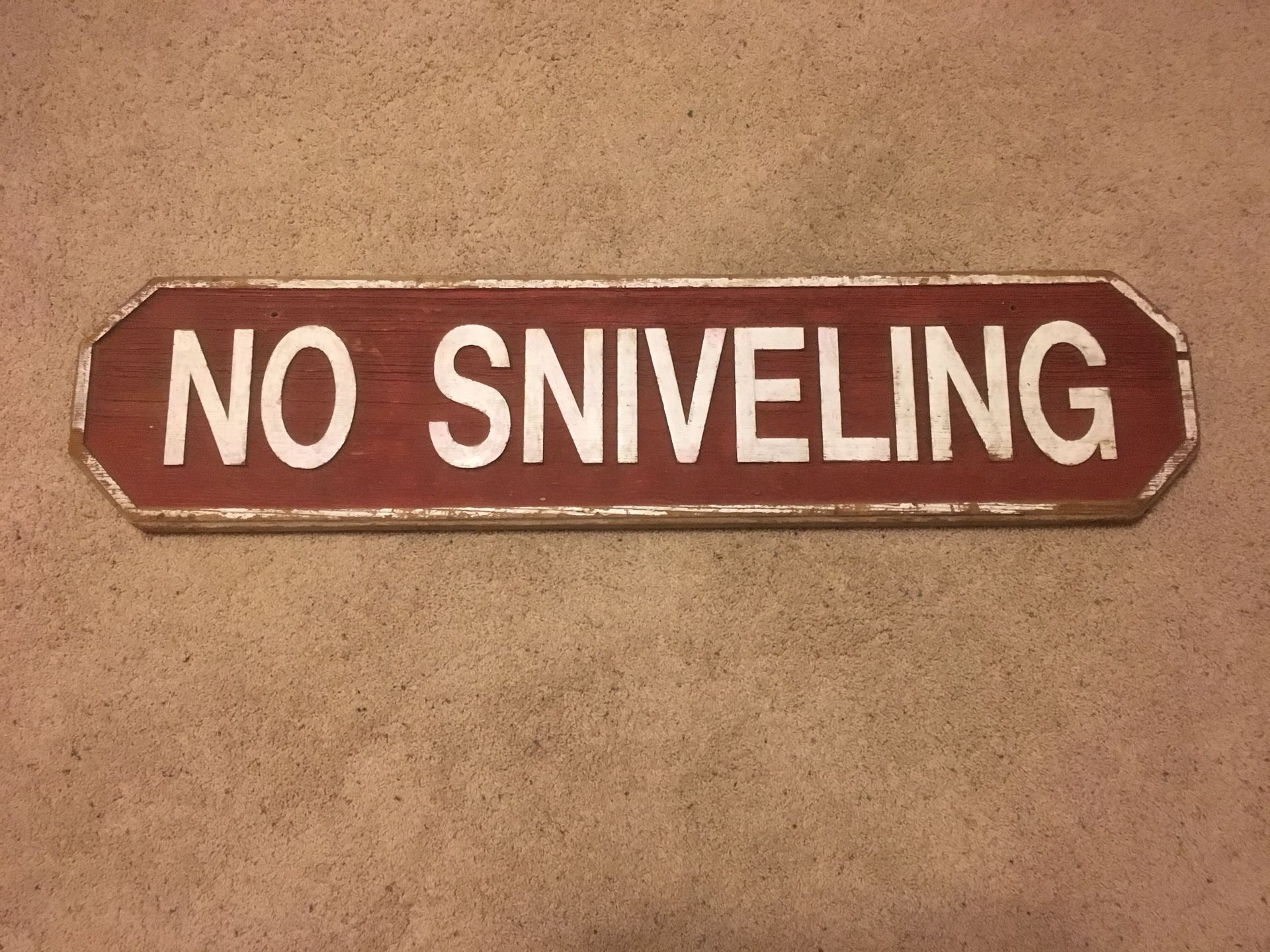“NO SNIVELING” wood sign
