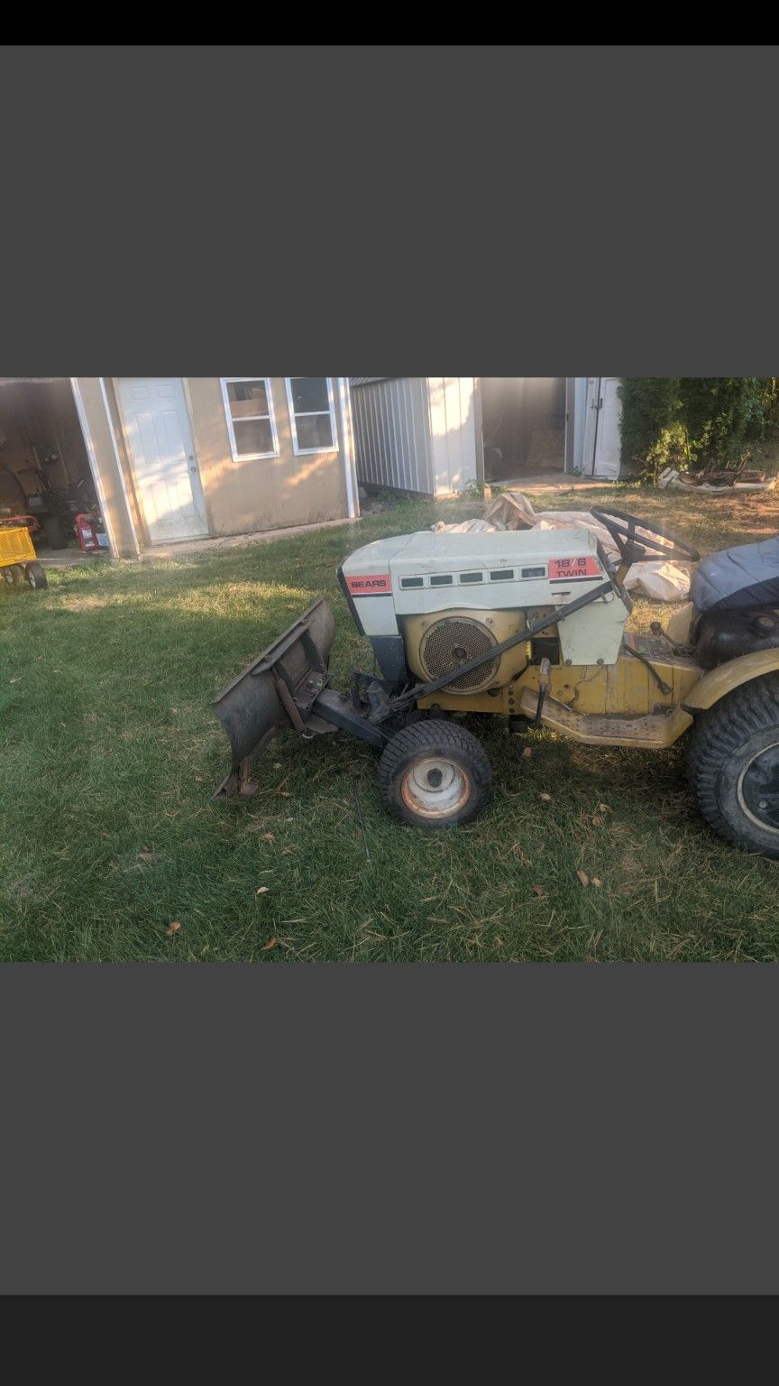 Sears garden tractor with plow and snow blower