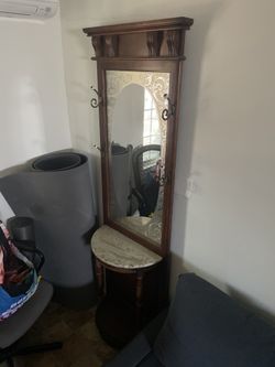 Vintage Pulaski hall tree with a marble top and etched mirror