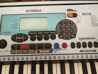 Yamaha keyboard and stand and music books