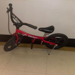 The image shows a Glide Bikes Go Glider Balance Bike, designed for children aged 5 to 10 years old. It is a pedal-less bike that helps children develo