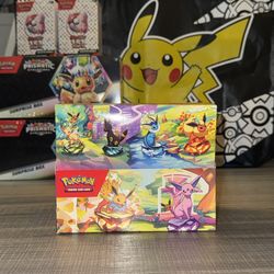 Sealed Pokemon Prismatic Evolutions Mini Tin Display