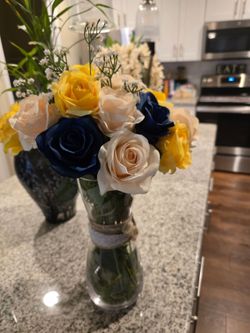 Silk flowers in a glass vase