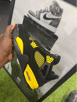 Yellow thunder Jordan 4s