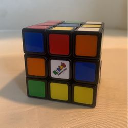 Rubiks Cube, Mini Rubiks Cube, And Slinky Toys