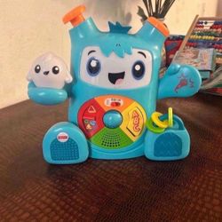 Fisher-Price Dance & Groove Rockit interactive musical toy with Smart Stages learning content for babies and toddlers