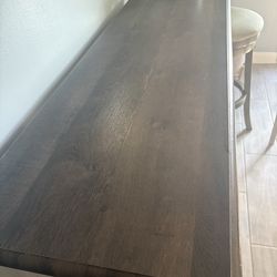 Selling a bar with two stools.