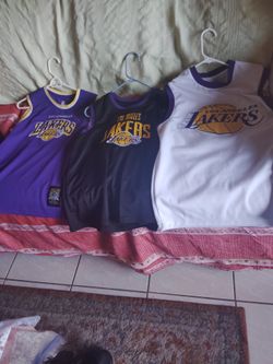 The white Jersey is a small lAnd other 2 jersey size is 18-20