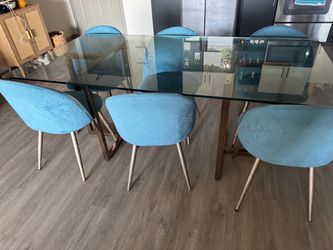 Glass dining room table with 6 chairs