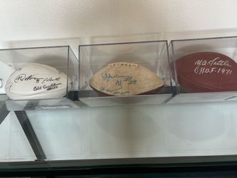 Three signed NFL footballs