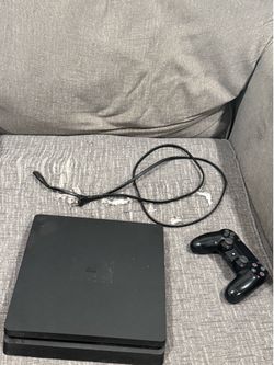 PS4 with controller and cable.