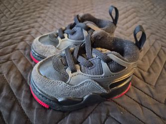 The Nike Air Jordan 4 RM Bred FQ7937-060 TD in size 3C  (MISSING BOX)