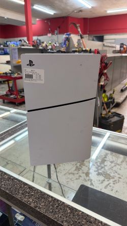 PlayStation 5 slim with power cords and controller