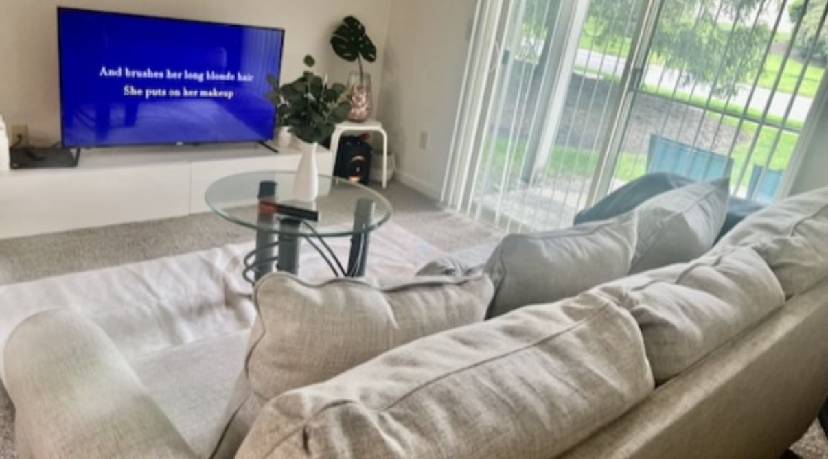 Four-seat sofa with light linen-tone upholstery