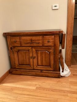 Solid wood buffet  with foldable sides  lots of storage  please check my other listings