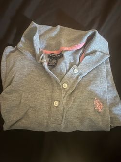 gray U.S. Polo Assn. short-sleeve polo shirt featuring pink accent trim and a matching embroidered pink logo on the chest.