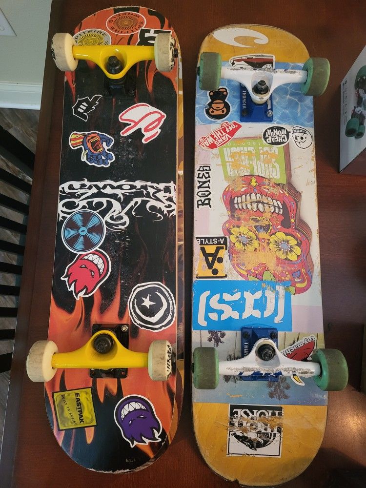 Two Skateboards and Three Skateboard Decks