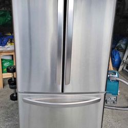 Lg 30" French door refrigerator, it is a stainless steel like in new condition.