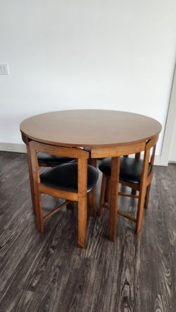 Brown Round Table with Wooden Chairs