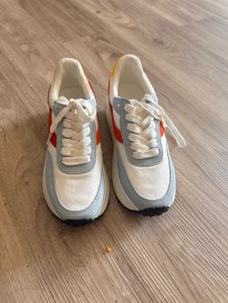 Steve Madden white sneakers with orange and light blue accents