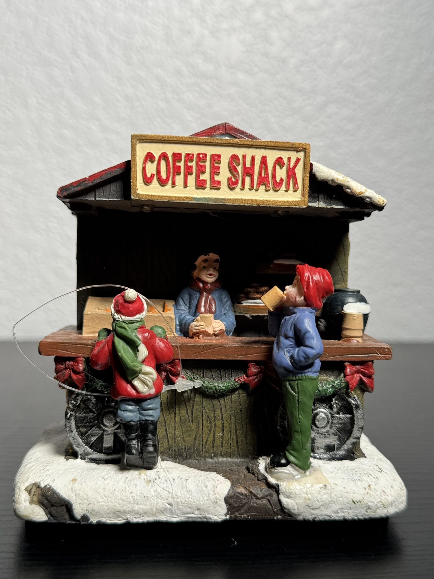 miniature christmas composition depicting a coffee shop