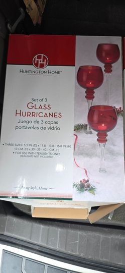 Huntington Home Set of 3 Glass Hurricanes (goblet-style tealight candle holders) featuring red and silver/speckled holiday designs.