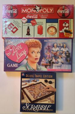 3 Board Games Coca-Cola Monopoly , I Love Lucy game and Scrabble Deluxe Travel Edition  $55