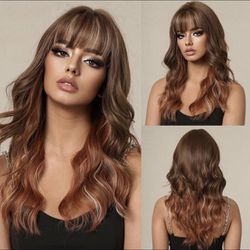 Human hair blend ombré brown to ginger color layered wavy wig.