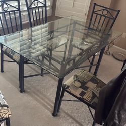 glass table with six chairs included 
