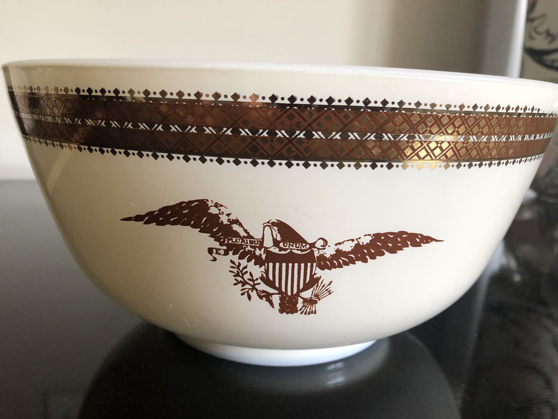 Vintage Pyrex deep dish decorated with a golden eagle