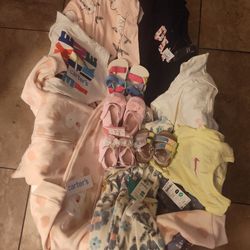 Baby tub with outfits and shoes