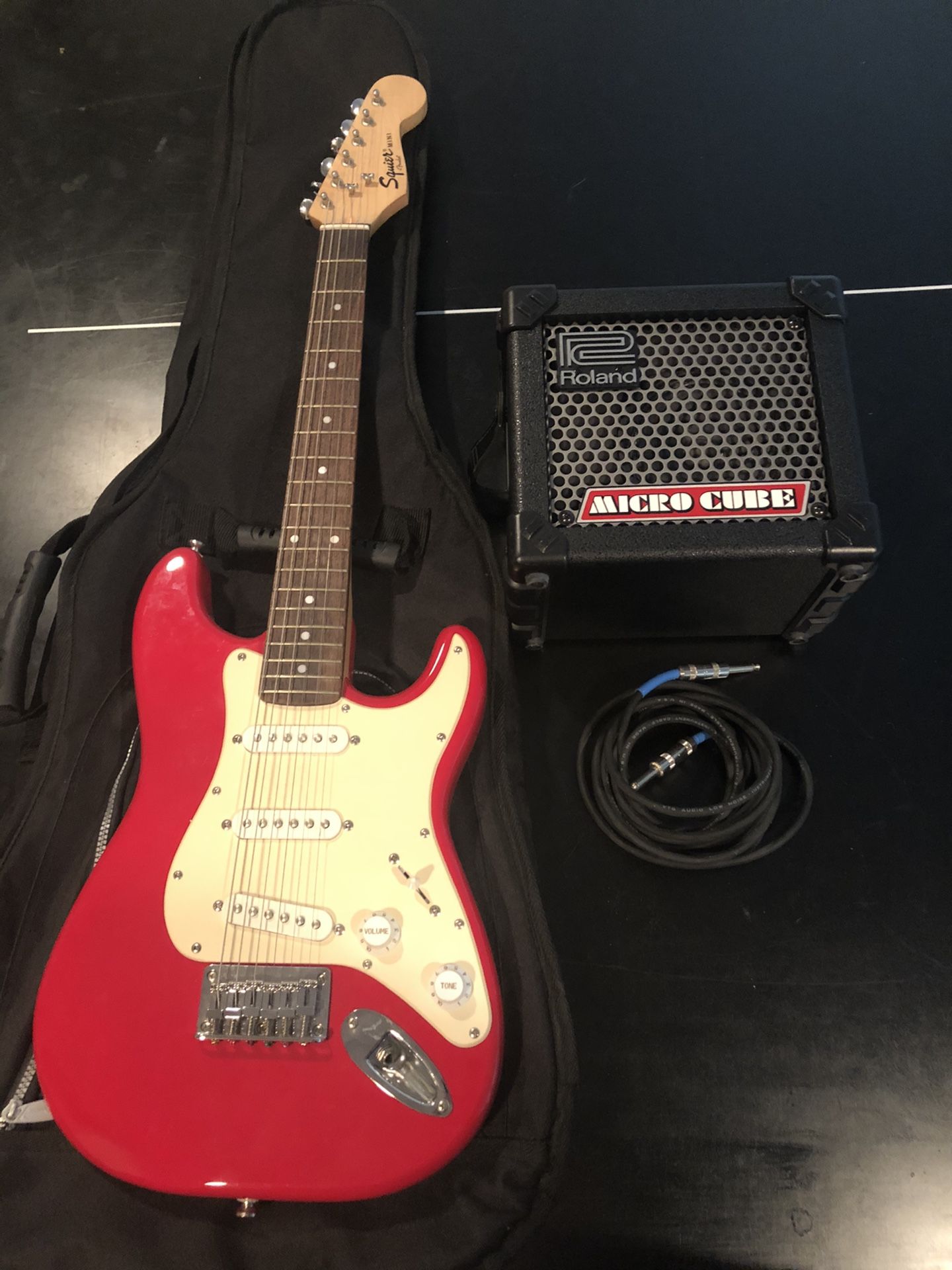 Squier Mini Strat Electric Guitar with Roland Amp and Gig Bag