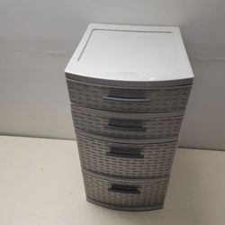 Grey  plastic 4 drawer cabinet.  Great For small dorm room  can be used on table top.  Store make up books,  etc. $5.00
