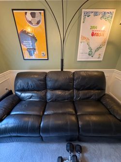Black leather reclining sofa
