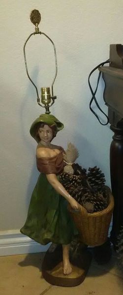 Vintage lamp of woman holding a basket