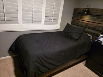 Twin bed with mattress and night stand