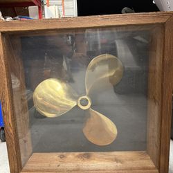 Vintage 22” brass ship propeller in wooden 30”x10” display case. 