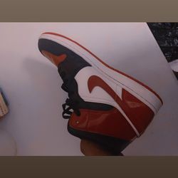 Air Jordan 1 Mid "Bred Toe" in a White/Black/Gym Red colorway.